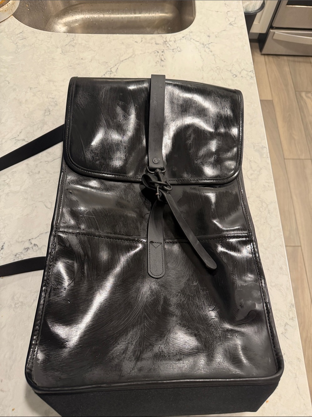 Rains Black Gloss Leather-Effect Men's Backpack with Strap Detail